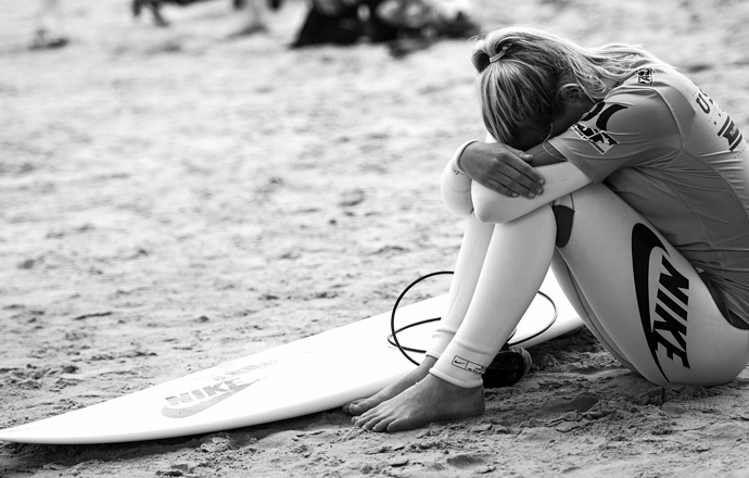 girl-surfing-beach-surfboard